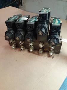 NACHI WET TYPE SOLENOID OPERATED DIRECTIONAL CONTROL VALVES ON MANIFOLD  - Picture 1 of 4