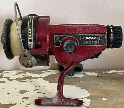 Carrete de pesca giratorio con rodamiento de bolas Silstar EX40 carrete de grafito y antirreverso Foto 1 de 4