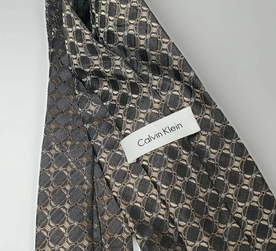 Calvin Klien Tie  with Silver Taupe with Geometric Design  100% Silk 4" x 58" - Image 1 of 3