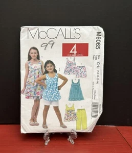 McCall's Pattern M6065 Girls Tops Dresses Shorts Capri Pants-Size 3-14 Uncut FF - Picture 1 of 4