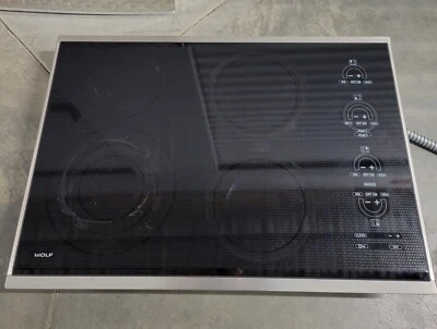 Placa de cocción eléctrica Wolf modelo CT30E/S negra con moldura de acero inoxidable 4 quemadores Foto 1 de 4