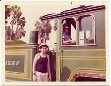 vintage color photo boy by train conductor in train Busch Gardens FL