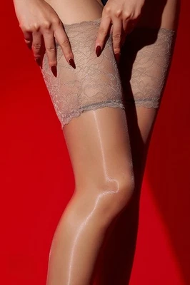 Medias de nailon brillantes brillantes hasta los muslos de silicona para mujer Foto 1 de 4