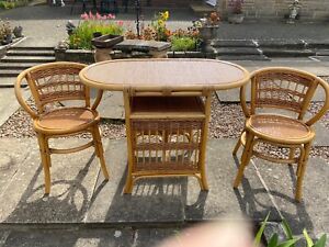 Cane Bistro table and two chairs. set of 3