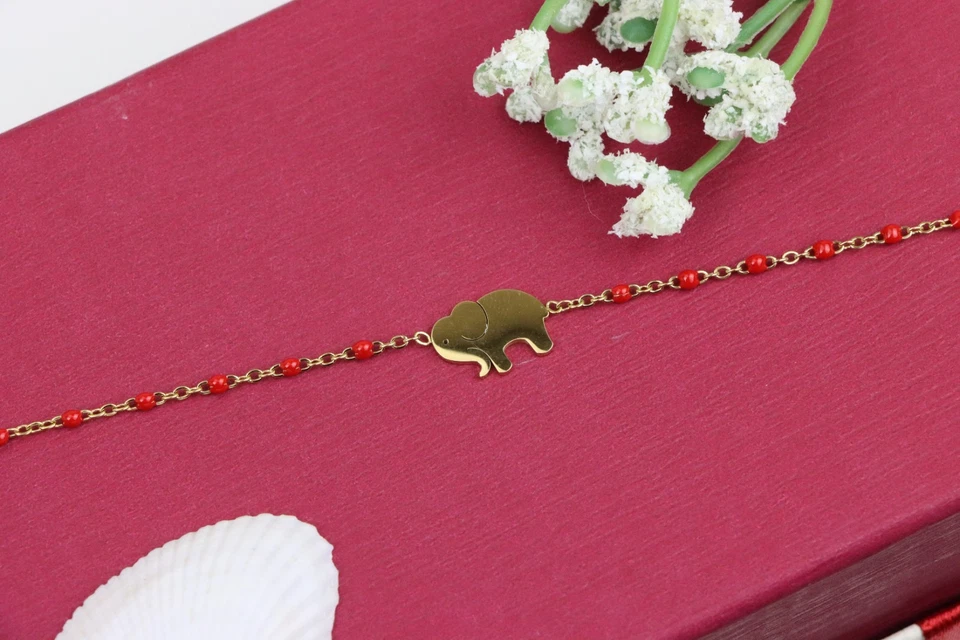 Elegante pulsera amarilla con dije de elefante y cadena de cuentas rojas, XPBL0658 Foto 1 de 4