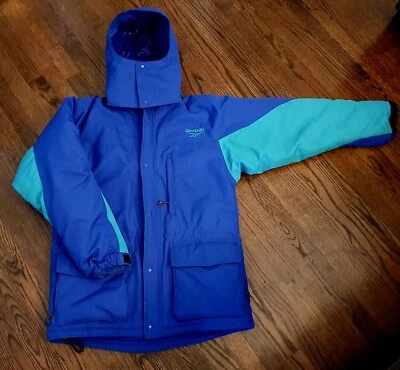 Abrigo de invierno Reebok Outdoor años 80 90 vintage con cremallera capucha bloques de colores azul verde  Foto 1 de 4