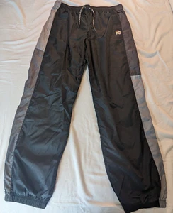 Pantaloni da pista Peloton Windbreaker da uomo XL stringhe nero e grigio nuovi con etichette $88 al dettaglio - Foto 1 di 11