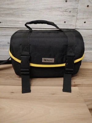 Bolsa para cámara Nikon correa de hombro ajustable inserciones extraíbles negro amarillo ribete Foto 1 de 4