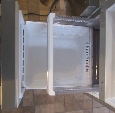 Silver Stainless Steel Samsung Side By Side style refrigerator - Image 1 of 4