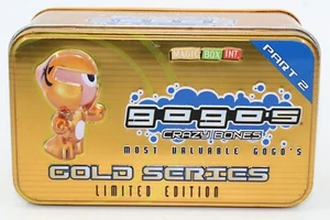 MAGIC BOX GOGO'S CRAZY BONES GOLD SERIES LIMITED EDITION 2 TIN LATA CON 55 GOGOS - Imagen 1 de 4