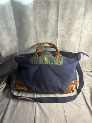 Bolso de viaje Polo Ralph Lauren de lona verde marino con adornos de cuero para fin de semana Foto 1 de 4