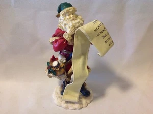 Weihnachtsmann hält Nauhty und schöne Liste: Weihnachtsmann Figur - Bild 1 von 3