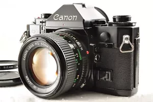 Canon A-1 fotocamera reflex pellicola nera con obiettivo NFD 50 mm F1,4 MF *e... - Foto 1 di 24