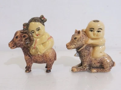 Netsuke niño japonés con perro y niña con cabra Foto 1 de 2