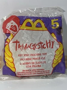 Vintage McDonalds Happy Meal Spielzeug Schlüsselanhänger 1997 Tamagotchi Figur #1 gelb neu - Bild 1 von 8