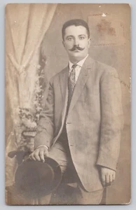 RPPC Handlebar Mustache Man holding hat, long striped suit, "For Hattie" 1904-18 - Picture 1 of 2
