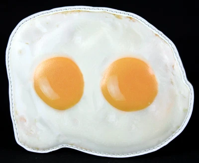 Cartera portatarjetas de cuero acolchada con huevo blanco y amarillo MOSCHINO COUTURE S/S 2025 Foto 1 de 4