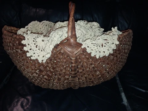 Antique Wicker Basket With Antique Quilt Cover