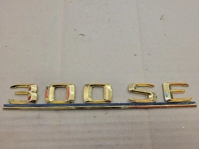 Mercedes OEM 1985-1992 300 SE 300SE New NOS Gold Rear Trunk Emblem Badge Logo - Image 1 of 4