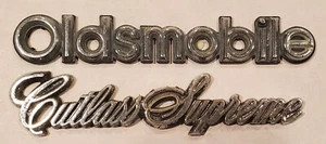 1985 Oldsmobile Cutlass Supreme Sedan 4-Door Bumper Emblems Badge Logo Vintage - Picture 1 of 4