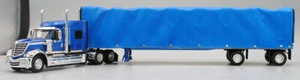 DCP FIRST GEAR ESCALA 1/64 INTERNACIONAL LONESTAR AZUL CON CORTINA REMOLQUE LATERAL - Imagen 1 de 4