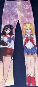 Sailor Moon Leggings Größe S und Buch Lunas Geheimnis Sehr Guter Zustand Manga - Bild 1 von 5