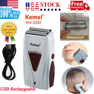 Maquinilla de afeitar eléctrica para hombre giratoria impermeable húmeda y seca Kemei USB Foto 1 de 4