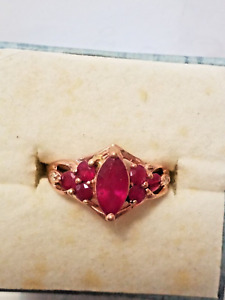1970's 10 KT SOLID ROSE GOLD RING WITH 7 RUBY 2 DIAMOND WEIGHT 1.9 GR  SIZE 6.5