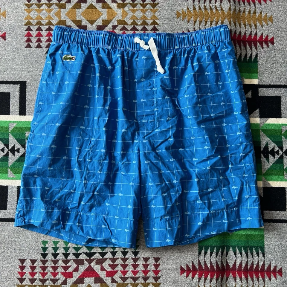 Pantalones cortos para dormir Lacoste para hombre medianos con estampado de logotipo azul bolsillos para salón C6 Foto 1 de 4