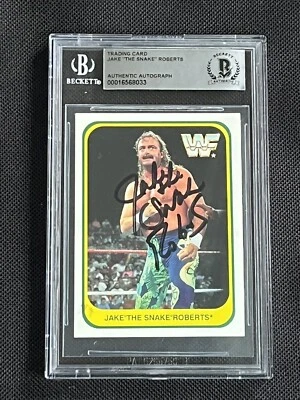 JAKE “THE SNAKE” ROBERTS 1991 MERLIN WWF SIGNED AUTOGRAPHED CARD BAS AUTHENTIC - Image 1 of 2