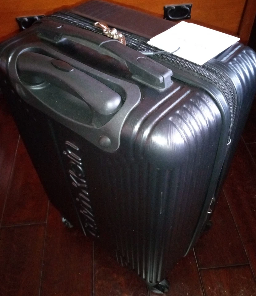 Calvin Klein 20in. Spinner Hardside Int'l Carry-on Luggage, Black - Image 1 of 3