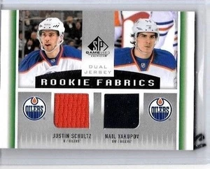 CAMISETAS DE NOVATO CON UÑAS YAKUPOV Y JUSTIN SCHULTZ 2013-14 SP DOBLES 2 COLORES USADAS - Imagen 1 de 1