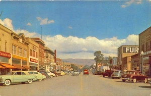 Postal Montpelier ID Street Store Fronts 1954 señalización autos antiguos - Imagen 1 de 2