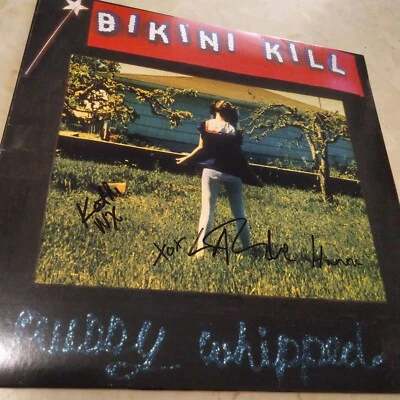SIGNED Bikini Kill - Pussy Whipped LP autograph signed by band - Image 1 of 3