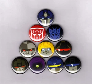 TRANSFORMERS MIGHTY MUGGS 1.5" PINS BUTTONS (prime starscream megatron g1 toys - Picture 1 of 2