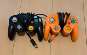 Nintendo Game Cube GC Controller control pad black orange 2 set wired used junk - Picture 1 of 1