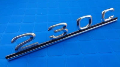 Mercedes Benz W123 230C trunk lid emblem designation script rear lid OEM NOS - Image 1 of 4