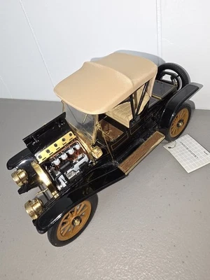 Franklin Mint 1910 Cadillac Roadster 1:24 Diecast Car Plus three more cars  - Image 1 of 4