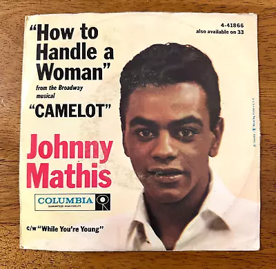 JOHNNY MATHIS CAMELOT "HOW TO HANDLE A WOMAN"-WHILE YOU'RE YOUNG 45 WITH SLEEVE - Image 1 of 4