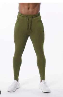 Jogger Alphalete Elmts con cremallera para hombre - oliva, talla mediana Foto 1 de 4