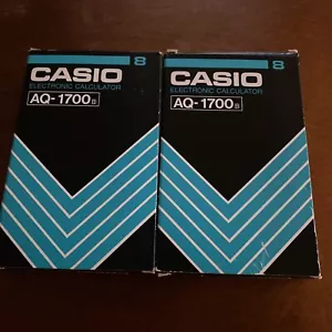 TWO NOS CASIO AQ-1700 ELECTRONIC CALCULATORS ALARM WATCH Japan Need Batteries - Picture 1 of 5