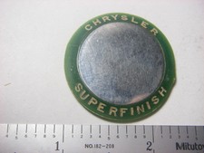 Chrysler superfinish vs ground surface advertising medal - green