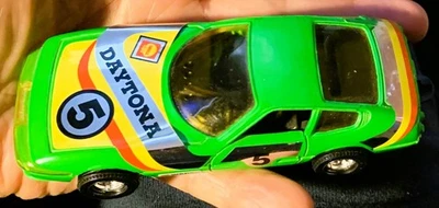 Vintage Corgi Toys Green Ferrari Daytona 1:36 Scale Race Car Doors Open Green - Image 1 of 4
