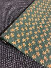1 mtr rose and hubble green gingerbread man print poly cotton fabric..45”wide