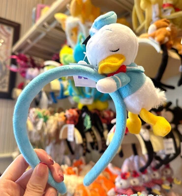 Lindo muñeco de peluche durmiendo diadema de pato Donald de los parques de Disney ratón orejas de dibujos animados Foto 1 de 4