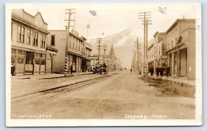 RPPC Downtown Main Street in Skagway Alaska  Postcard - Picture 1 of 2