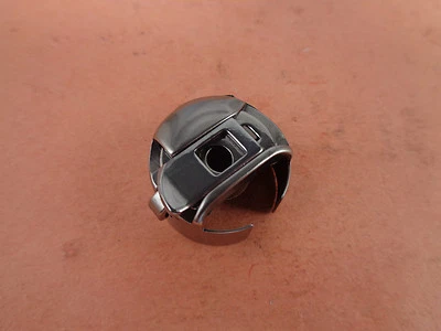 BOBBIN CASE XC7206001 541678 - BROTHER PR600 BABYLOCK EMP6 EMBROIDERY - Image 1 of 2