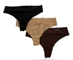 Paquete de tres bragas de tanga invisibles sin costuras para mujer Calvin Klein medianas QD3558 - Imagen 1 de 7
