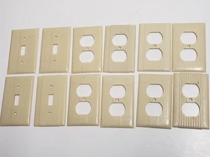 Vtg Lot of 12 1960s EAGLE, UNILINE Cream Ribbed Art Deco Switch Plug Wall Plates - Picture 1 of 6