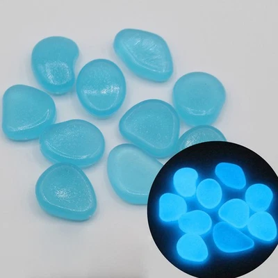 100 piezas piedras luminiscentes coloridas que brillan en guijarros oscuros para decoración de pecera Foto 1 de 4